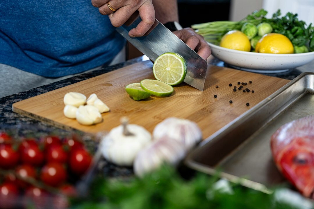 person chopping vegetables