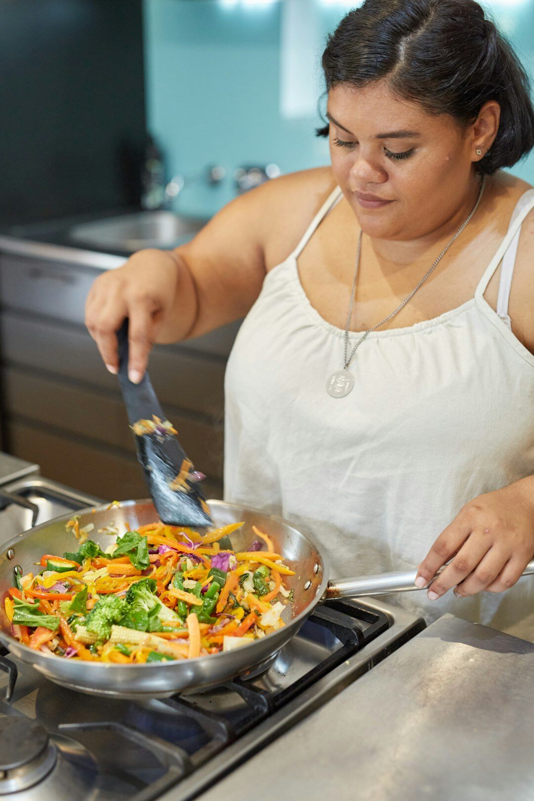 person cooking on stove