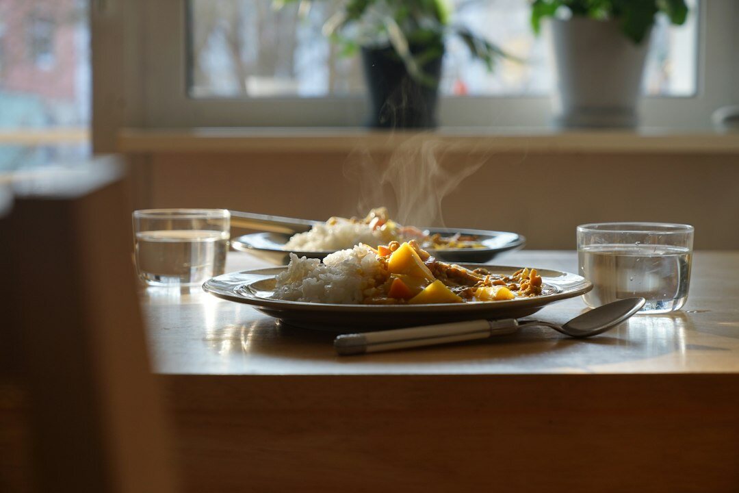 Traditional Czech svíčková with bread dumplings and cranberries on a wooden table