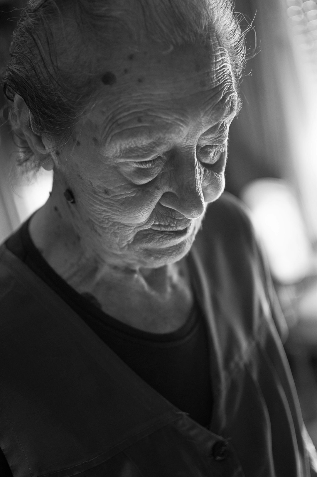 Portrait of an older Czech woman smiling warmly at home